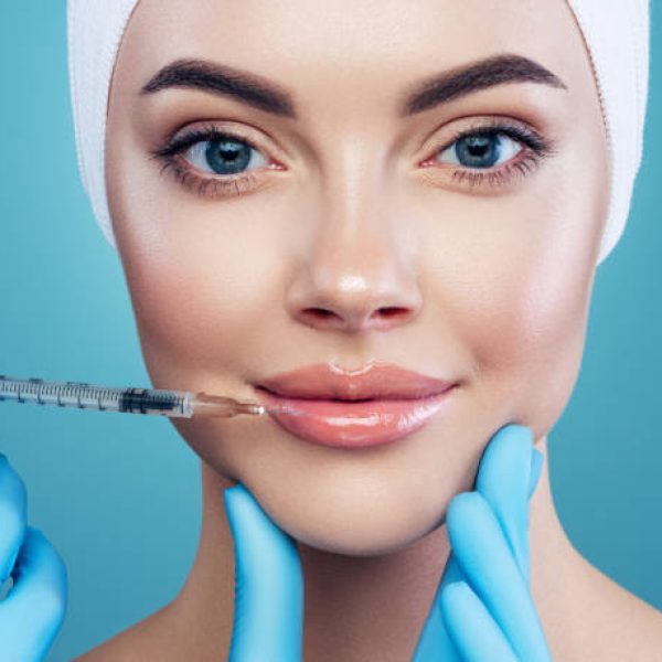 Woman having facial injection